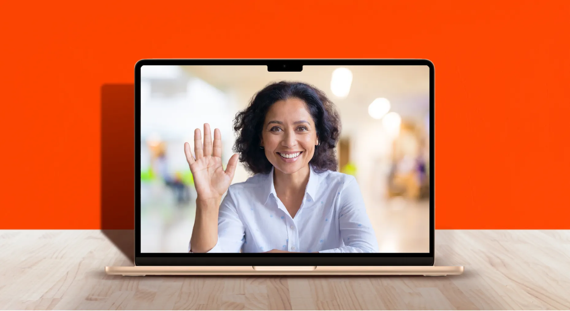 Laptop computer with female smiling on screen