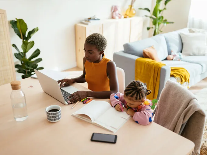 Nurse taking an online lesson with her daughter 