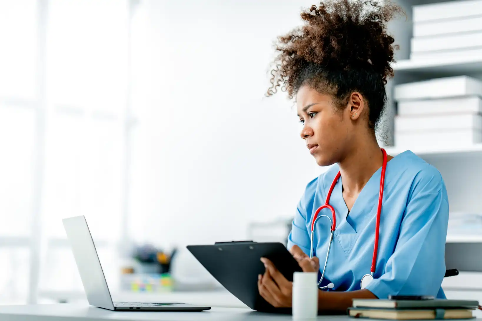 Nursing student studying with atomic habits.