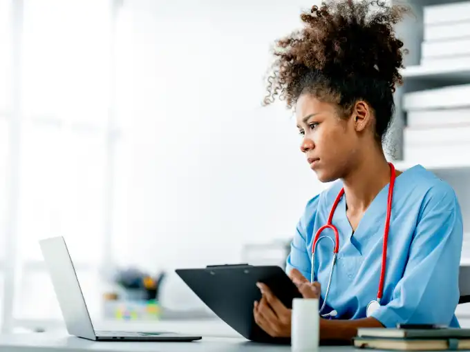 Nursing student studying with atomic habits.