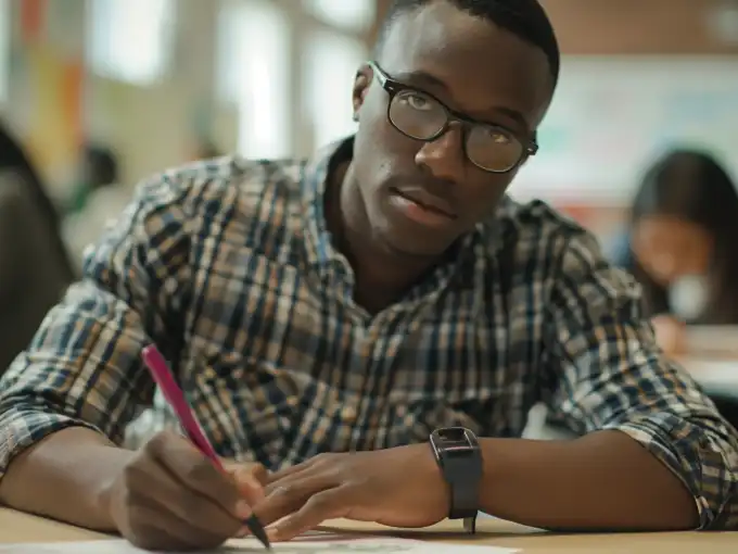 Male student studying whether to take CLEP vs AP exam.